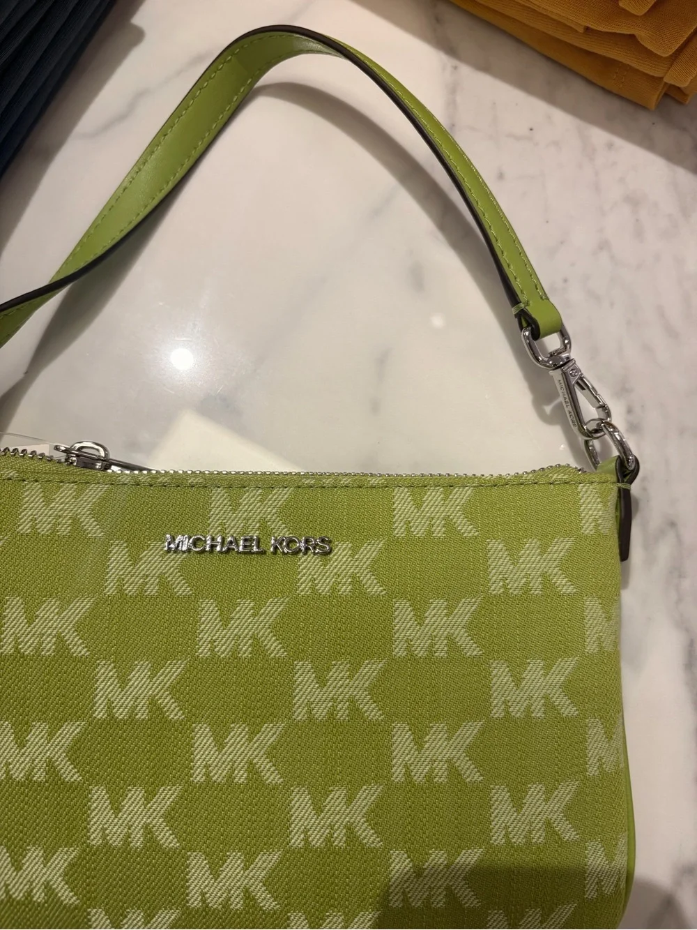 Michael Kors Signature Wristlet Clutch signature logo pink / brown/green